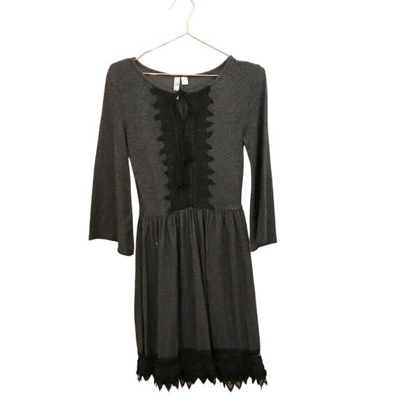 Alya Dresses & Skirts - Francesca’s Alya boho long sleeve dress with tassel and crochet lace trim